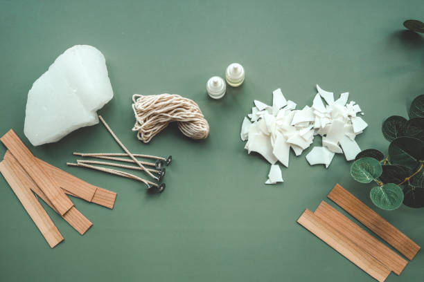 istock Soy wax candle, wooden wicks and eucalyptus, flat lay top view 1623644578