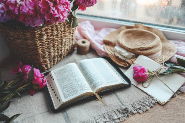 istock Open bible in home morning interior 1623654782