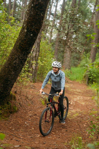 istock Woman and man riding mountain bikes 1623657510