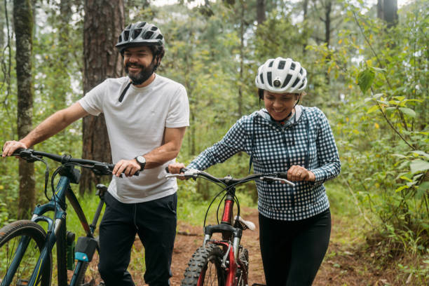 istock Woman and man riding mountain bikes 1623658602
