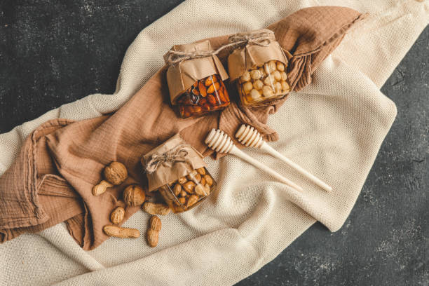 Craft jars with honey and nuts top view