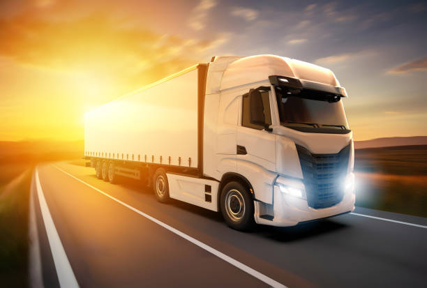 istock Generic and unbranded white truck speed driving at sunset, 3D illustration 1623662433