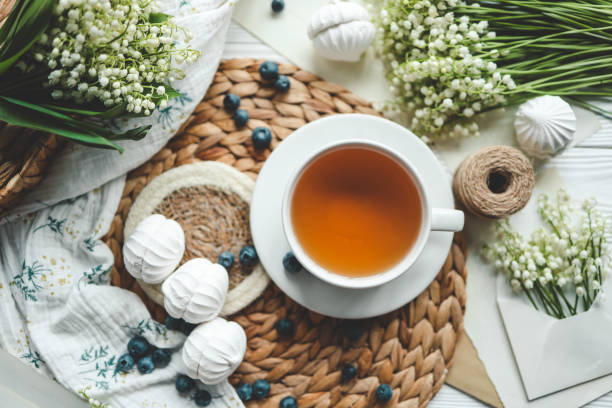 Cup of tea and summer composition, flat lay top view