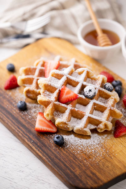 istock belgium waffle with strawberry, blueberry and honey 1623706843