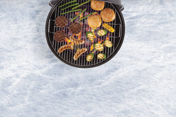 istock Winter bbq grilling on a snow on the ground 1623712378