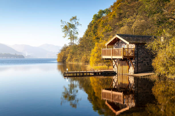 Duke of Portland Boathouse on a bright misty morning, Ullswater in the Lake District National Park, England