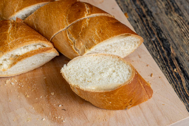 istock pieces of soft baguette on a cutting board 1623804876