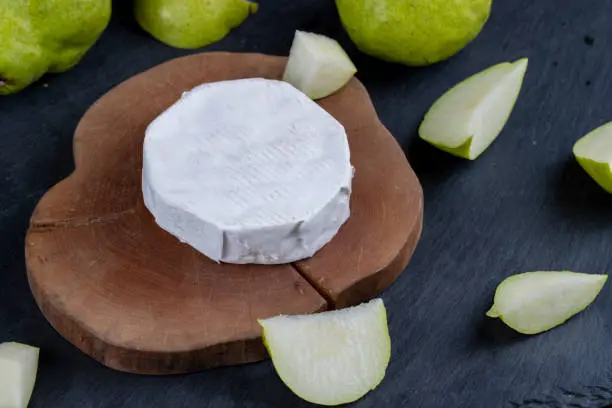 Photo of soft fresh hard cheese with white mold, delicious cheese