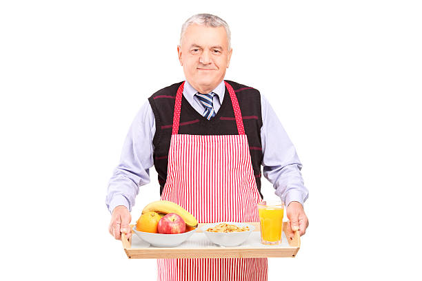 istock Smiling gentleman carrying a tray with drinks and food 162382278