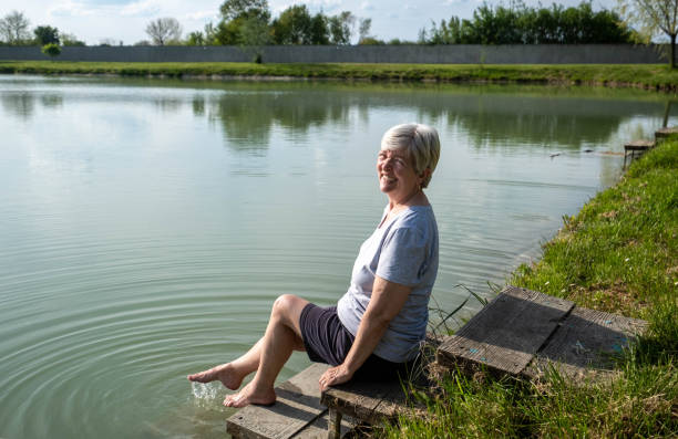 istock grandma sits by the lake 1623833574