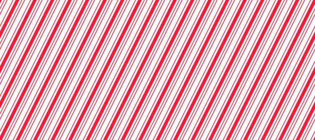 Vector illustration of Red and white Christmas seamless pattern. Candy cane diagonal stripes background. Repeating decoration wallpaper. Winter holidays lines backdrop. Xmas peppermint present wrapping print design. Vector