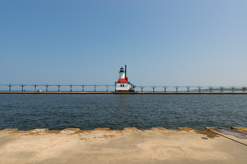 The St. Joseph Lighthouse on Lake Michigan on a sunny afternoon.
