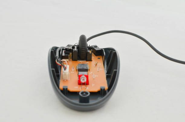 Open computer mouse with exposed electronic circuit for maintenance, symbol of technology and modern computing. Perfect for technology concepts, digital age symbol and technology solutions.