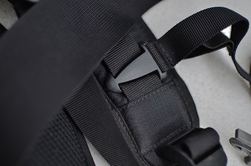 Black suspender or belt close-up, elegant and high-quality accessory to complete your style. Concept for backpacks or military accessories.