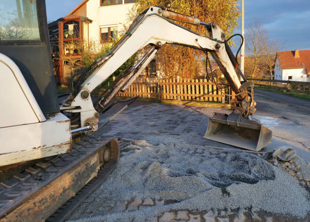 istock Excavator shovel distributes paving stones 1623913313