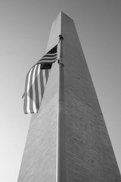 The Washington Monument and American Flag stock photo