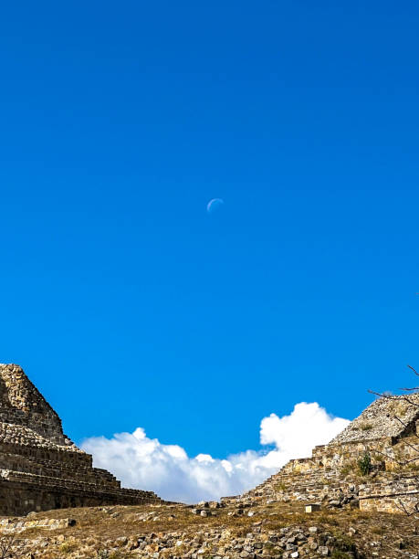The Moon Above The Ruins of Monte Alban On A Sunny Day stock photo