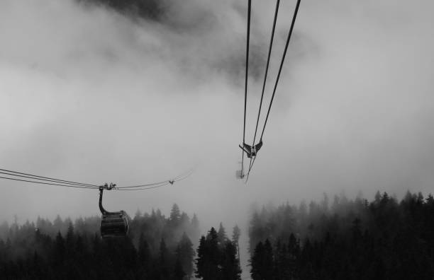 Traveling Through The Clouds On a Gondola stock photo