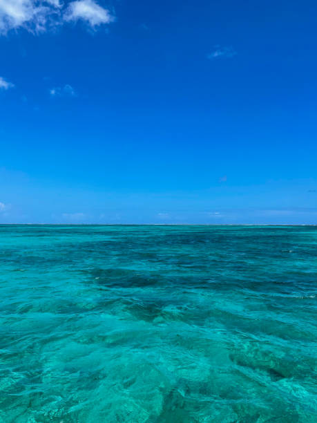 Blue Sky With Clouds Over Turquoise Sea stock photo