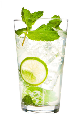 Lemonade, lemon, mint, and straw on white background, refreshing, nutritious and healthy drink