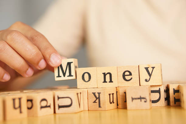 istock woman texting the word money 1623971650