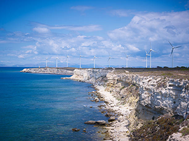 istock Rocky seashore and Wind turbines 162397522