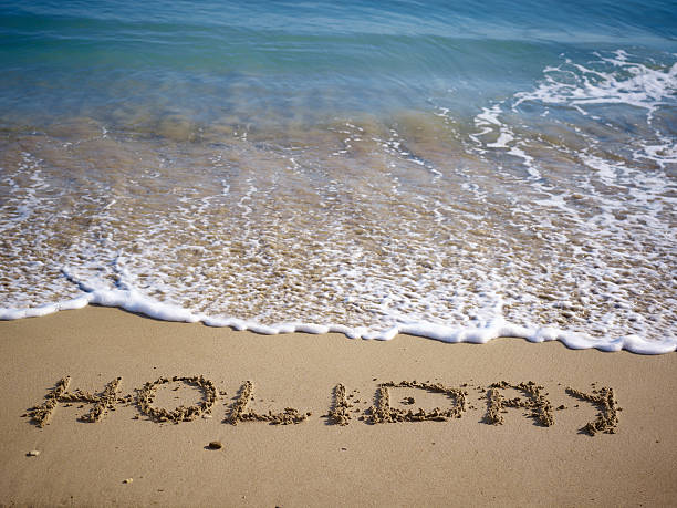istock Holiday written sand on the beach 162397651
