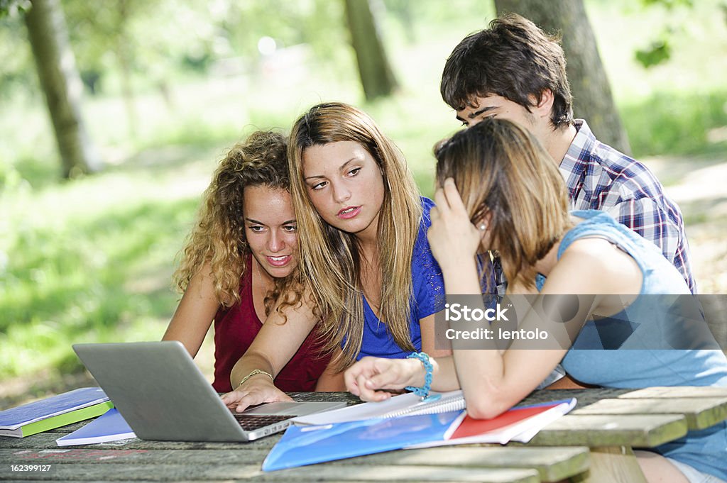 Group of young student using laptop outdoor,Italy Computer Stock Photo