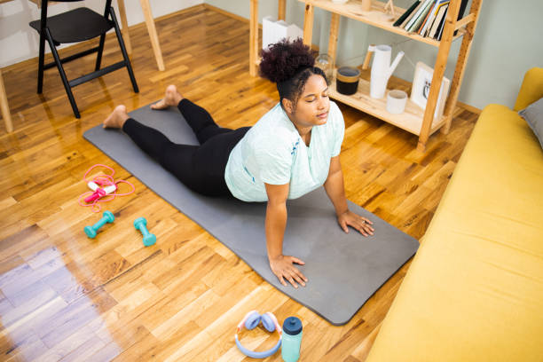 istock Young woman exercising exercising at home 1624003162