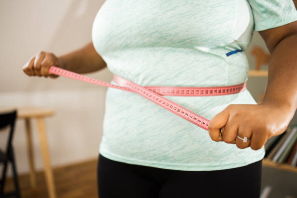 istock Young woman exercising exercising at home 1624003545