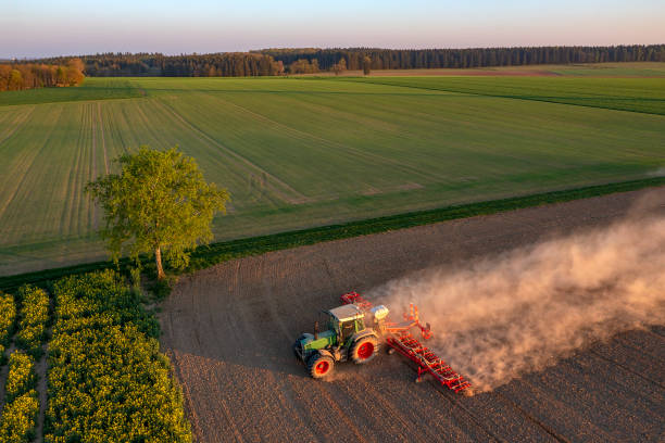 istock Tractor kicking up dust in field 1624005832
