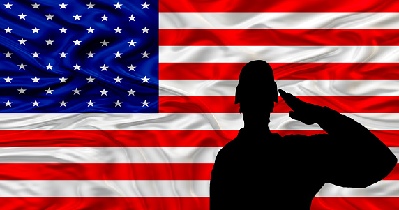 Silhouettes of soldiers with USA flag against the sunset. Greeting card for Veterans Day, Memorial Day, Independence Day