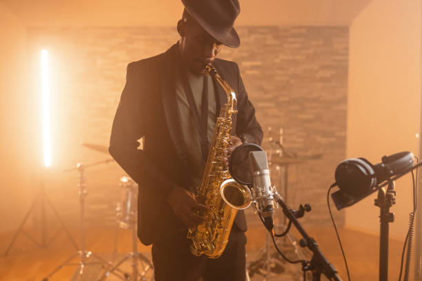 istock Adult Black Male Playing Saxophone In A Studio 1624018971