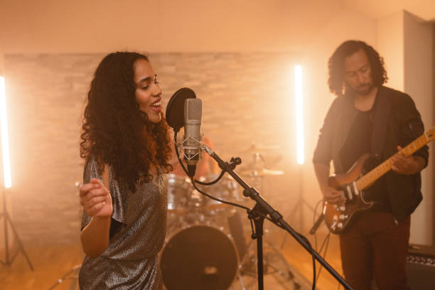 istock Happy Band Members Recording A Song In A Beautiful Studio 1624019709