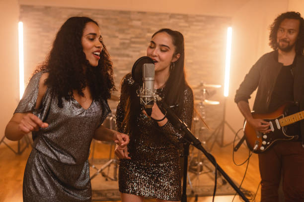 istock Diverse Band Enjoying Recording A Song In A Recording Studio 1624019716