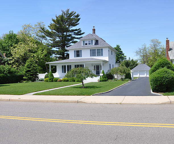 istock Suburban Home with Blacktop Driveway Sunny Blue Sky Day 162402124