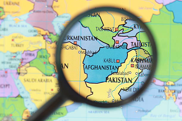 карта афганистане - focus globe magnifying glass glass стоковые фото и изображения