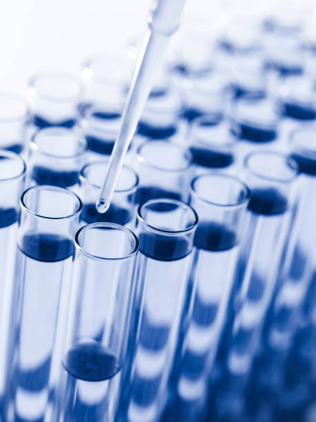 istock Droplet Falling from Pipette into Test Tube. 1624080677