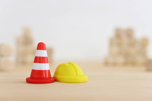 istock Traffic cone and helmet. Concept of construction and safety 1624096307