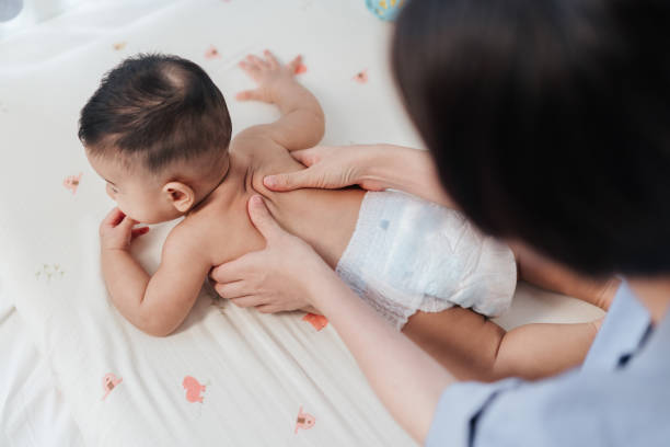 istock Top view, Baby back massage for stimulate development by mother. Mother makes massage for happy baby. Infant healthcare concept. 1624115303