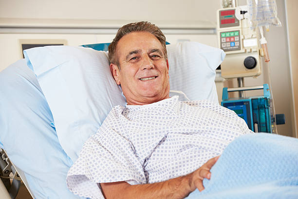 istock Male patient lying in hospital bed 162412055
