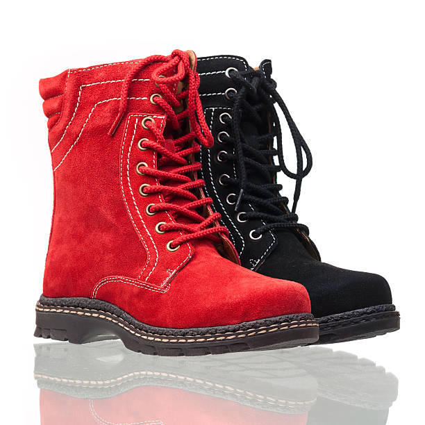 istock Red and black ankle high women boots over white 162412127