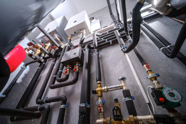 Modern electric boiler room in the house Modern electric boiler room in the house. Equipment for water heating system with automatic control unit piping hot stock pictures, royalty-free photos & images