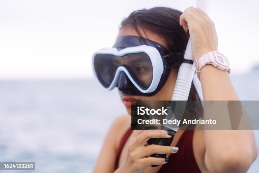 istock Close Up Asian Woman Wearing Snorkle on Wooden Boat 1624133261