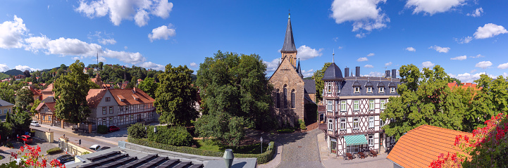 Panoramic view of the facade and bell tower of the Church of St. Sylvester on a sunny day. Germany. Saxony-Anhalt. Wernigerode