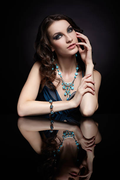Portrait of a girl holding a diamond in her hand