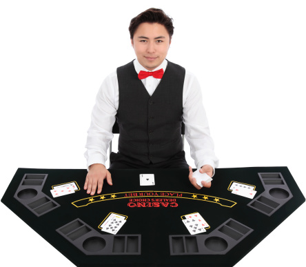 Black jack dealer with cards, wearing a vest and red bow tie. White background.