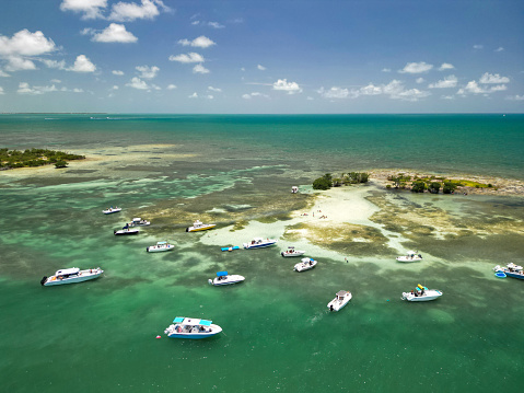 Boaters anchored at a small island, enjoying a sunny Summer day near Marathon in the Florida Keys