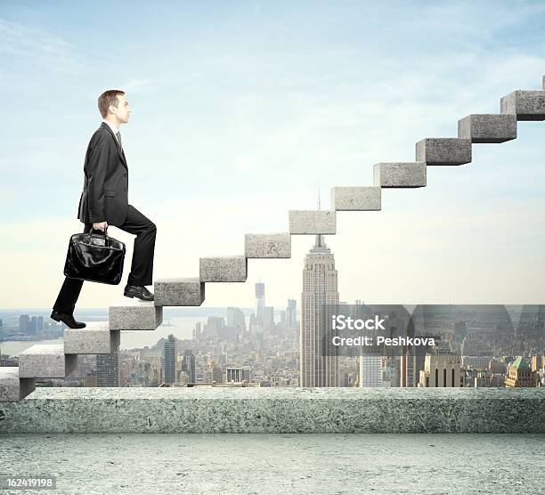 A Businessman Walking On A Staircase Stock Photo - Download Image Now - Achievement, Adult, Adversity