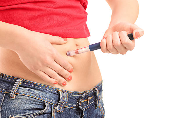istock Young female injecting insulin in her abdomen 162420597